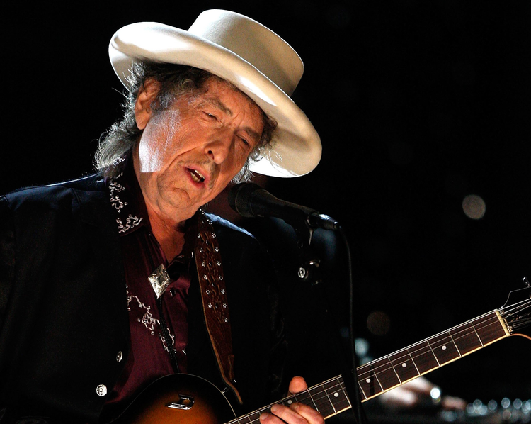 Bob Dylan playing guitar with hat Boston memorabilia