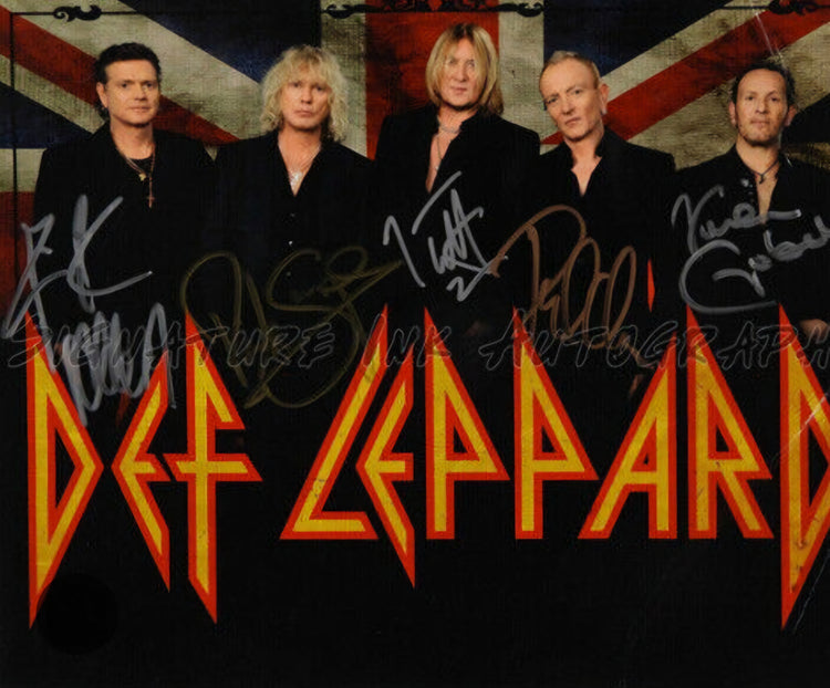 Def Leppard sign photo standing in front of Def Leppard logo Boston memorabilia