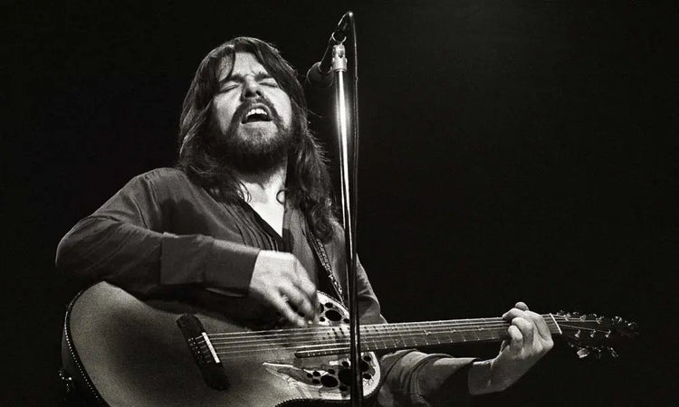 Bob Seger playing guitar on stage Boston memorabilia