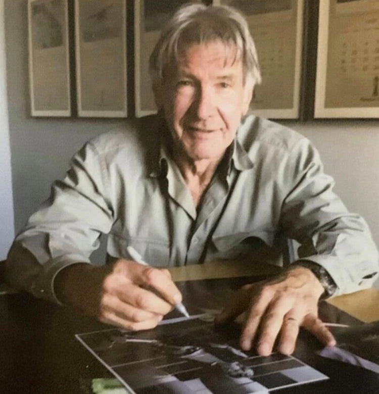 Harrison Ford signing autograph at table photo Boston memorabilia