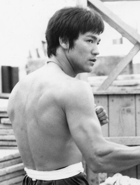 Bruce Lee action black and white photo