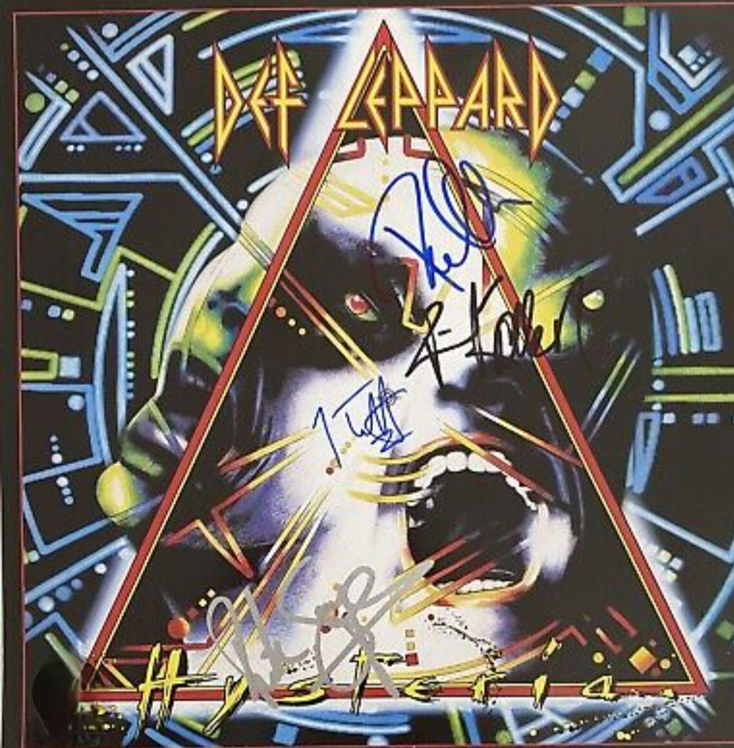 Def Leppard signed album pyramid on front