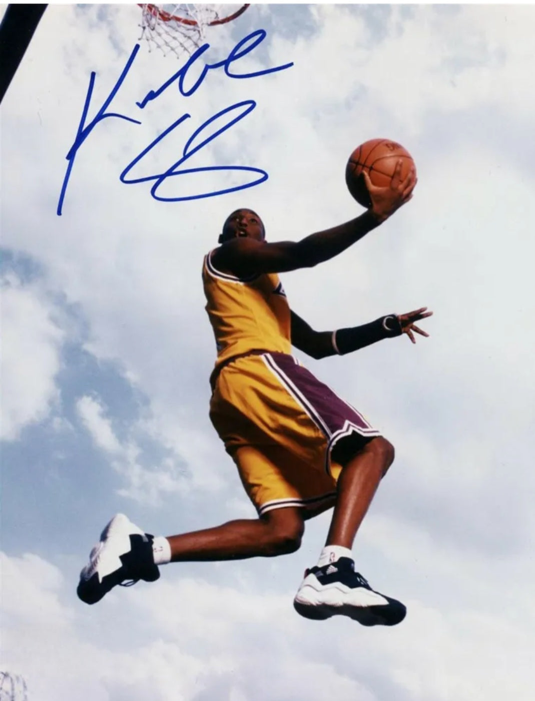 Kobe Bryant signed photo flying through