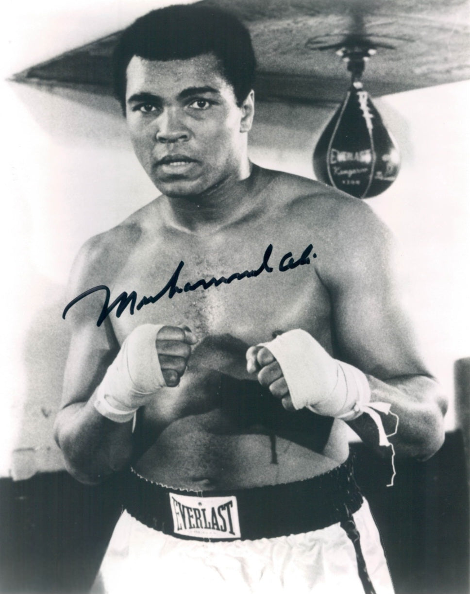 Muhammad Ali signed photo holding up fist