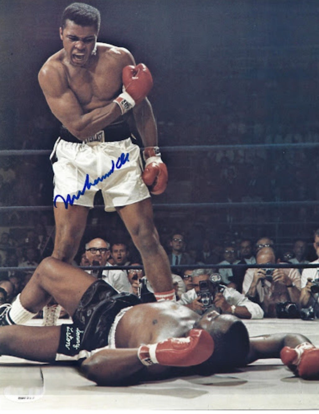 Muhammad Ali signed photo knocking down an opponent