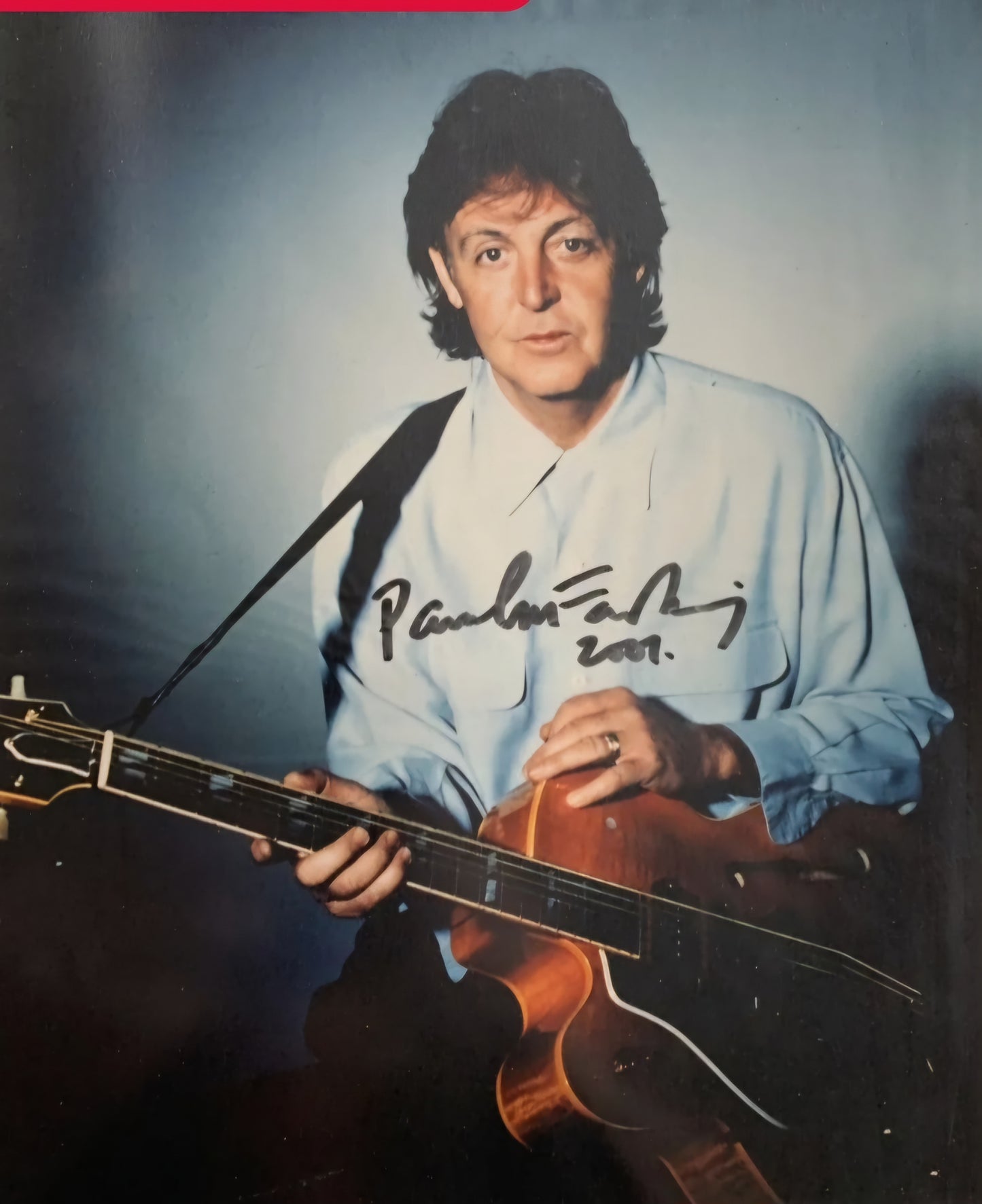 Paul McCartney signed photo with guitar