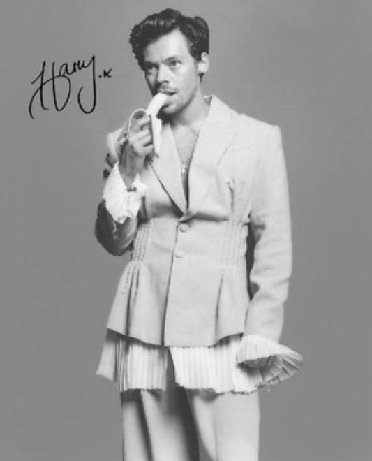 Harry Styles signed photo eating banana