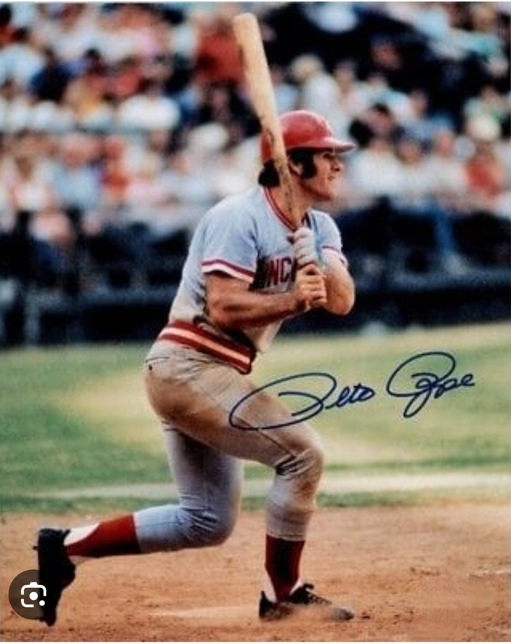 Pete Rose signed photo swinging back