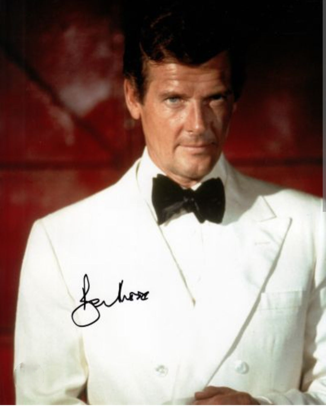 Roger Moore signed photo white tuxedo movie scene