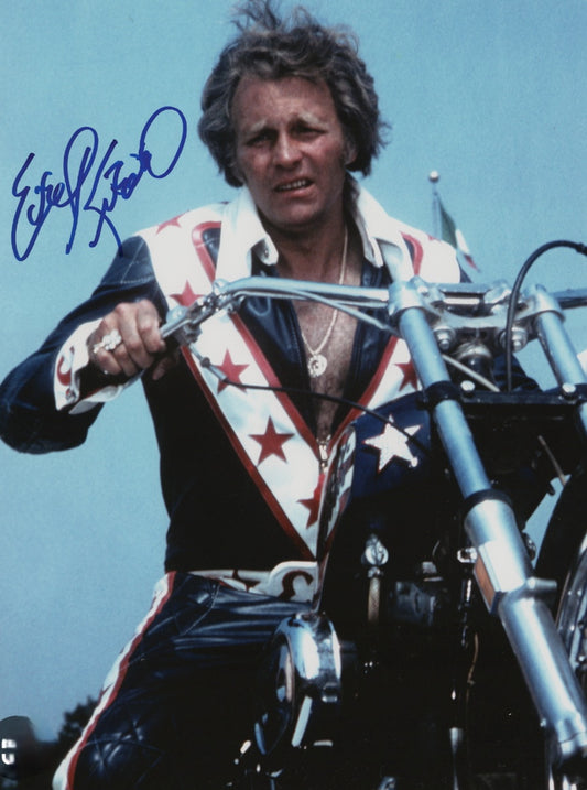 Evel Knievel signed photo sitting on motorcycle 