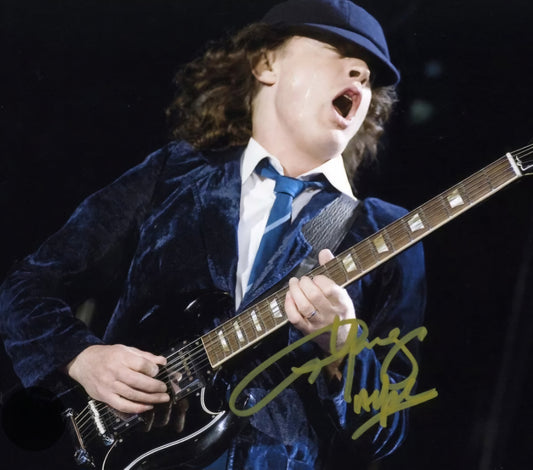 Angus Young signed photo playing guitar