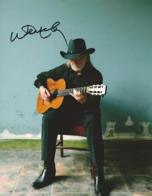 Willie Nelson signed autographed photo playing my guitar in the chair