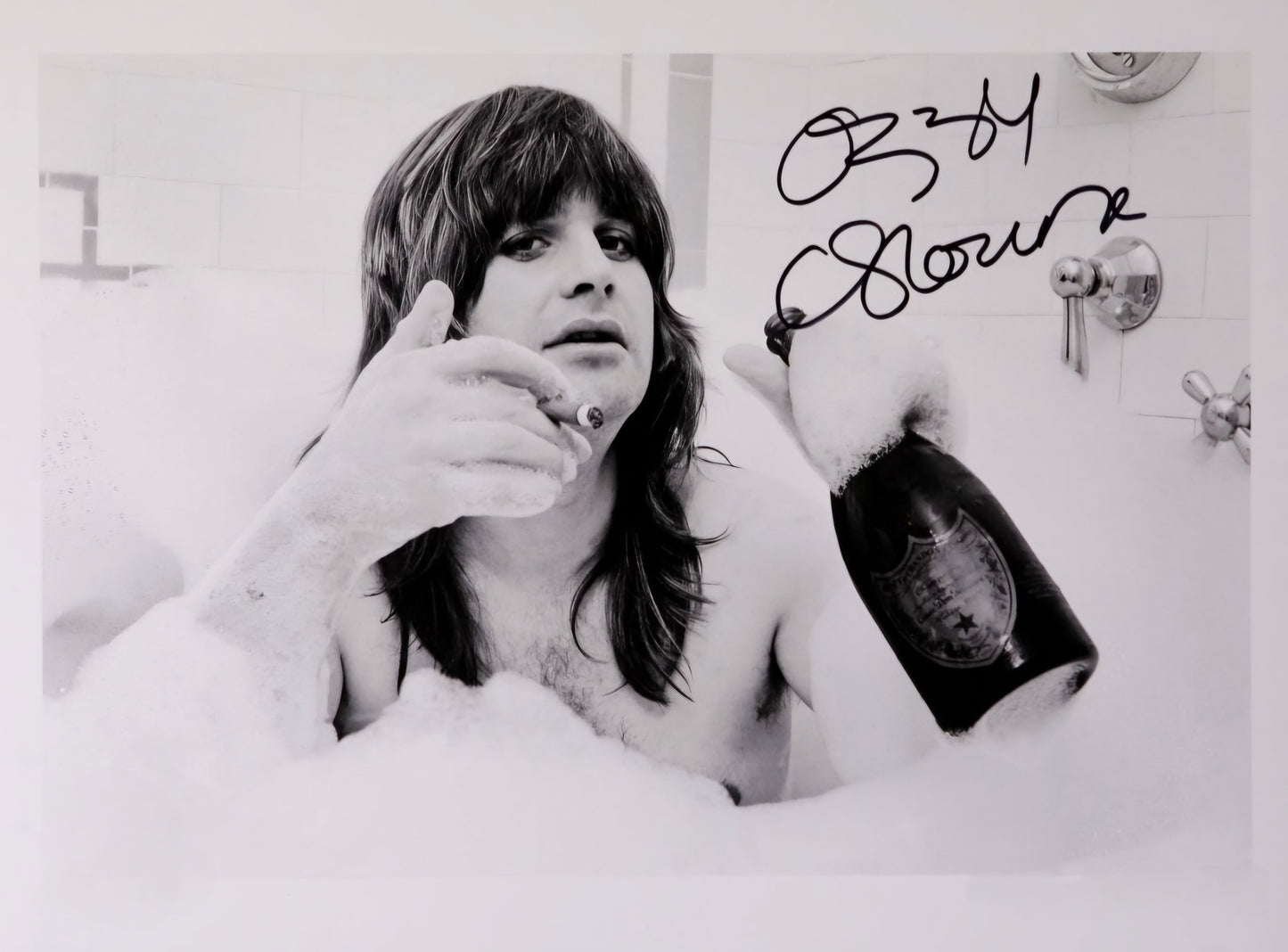 Ozzy Osbourne signed autographed photo black and white laying on his stomach