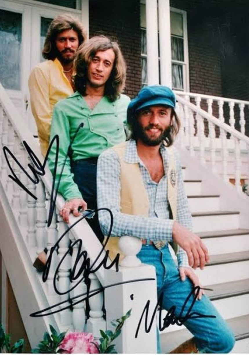 The Bee Gees signed photo standing on the steps of a house Boston memorabilia