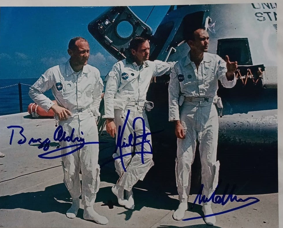 Apollo 11 crew signed photo standing in front of spaceship