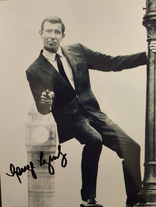 george lazenby autographed photo with gun in hand